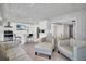 Open floor plan showing kitchen and living room with white walls and unique ceiling feature at 307 Orangewood Ln, Largo, FL 33770