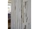 Close up of a white textured wall with vertical distressed pattern at 307 Orangewood Ln, Largo, FL 33770