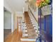 This inviting foyer features wood flooring, staircase and neutral decor at 3212 W Villa Rosa St, Tampa, FL 33611