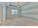 Serene bedroom with tray ceiling, neutral paint, and plush carpet flooring, creating a relaxing retreat at 32829 Woodthrush Way, Wesley Chapel, FL 33545