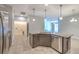 Well-appointed kitchen boasts granite countertops, stainless steel appliances, and an open layout for easy entertaining at 32829 Woodthrush Way, Wesley Chapel, FL 33545