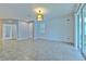 Bright, open living room with tile floors, neutral paint, and contemporary light fixture, awaiting your personal touch at 32829 Woodthrush Way, Wesley Chapel, FL 33545