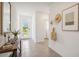 Inviting foyer with neutral tile flooring, ample natural light, and stylish decor at 33096 Osprey Peak Way, San Antonio, FL 33576