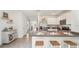 Modern kitchen featuring stainless steel appliances, sleek countertops, and ample bar seating at 33096 Osprey Peak Way, San Antonio, FL 33576