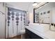 Bathroom featuring single vanity, white sink, a decorated shower curtain, and tile floor at 4034 Paddlewheel Dr, Brandon, FL 33511