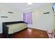 Inviting bedroom features a daybed, wood floors, and plenty of natural light at 4034 Paddlewheel Dr, Brandon, FL 33511