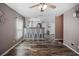Open dining area with modern lighting, breakfast bar, seating, and durable wood flooring, perfect for Gathering meals at 4034 Paddlewheel Dr, Brandon, FL 33511