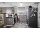 Modern kitchen with stainless steel appliances, gray cabinets, and stylish countertops at 4034 Paddlewheel Dr, Brandon, FL 33511