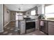 Modern kitchen with stainless steel appliances, gray cabinets, and stylish countertops at 4034 Paddlewheel Dr, Brandon, FL 33511