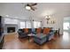 Inviting living room with cozy fireplace, comfortable seating, and stylish hardwood floors at 4034 Paddlewheel Dr, Brandon, FL 33511