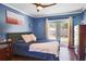 Inviting main bedroom with neutral tones, French doors, and natural light at 4034 Paddlewheel Dr, Brandon, FL 33511