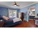 Serene main bedroom with hardwood floors, and ensuite bathroom access at 4034 Paddlewheel Dr, Brandon, FL 33511