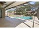 Backyard screened-in pool features a pool, spa, and stamped concrete patio at 4034 Paddlewheel Dr, Brandon, FL 33511