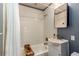 Bathroom with white tile walls, a shower-tub combo, and a sink with a vanity at 4334 18Th N St, St Petersburg, FL 33714