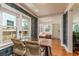 Sunlit dining area boasting hardwood floors, stylish wallpaper, and a view into the bright entryway at 4334 18Th N St, St Petersburg, FL 33714