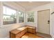 Cozy entryway featuring a wooden bench, bright natural light, and a welcoming front door at 4334 18Th N St, St Petersburg, FL 33714