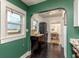 A kitchen area featuring green walls, an arched doorway, and a view into another room at 4334 18Th N St, St Petersburg, FL 33714