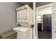 This is an interior shot of a laundry area showing the white stacked washer and dryer at 4334 18Th N St, St Petersburg, FL 33714