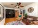 Stylish living room with hardwood floors, a cozy leather seating arrangement, and unique decor at 4334 18Th N St, St Petersburg, FL 33714