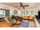 Bright living room with hardwood floors, a comfortable seating arrangement, and plenty of natural light at 4334 18Th N St, St Petersburg, FL 33714