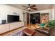 Spacious living room featuring hardwood floors, a modern entertainment center, and comfortable seating at 4334 18Th N St, St Petersburg, FL 33714