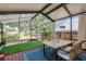 An outdoor entertaining space is provided with the screened in porch and dining set at 4334 18Th N St, St Petersburg, FL 33714