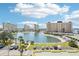 Expansive aerial view of the community featuring large buildings and a beautiful lake on a sunny day at 4725 Cove Cir # 604, St Petersburg, FL 33708