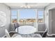 Cozy breakfast nook with a round glass table and large windows showing the waterfront view at 4725 Cove Cir # 604, St Petersburg, FL 33708
