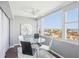 Cozy breakfast nook with a round glass table and large windows showing the waterfront view at 4725 Cove Cir # 604, St Petersburg, FL 33708