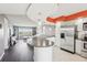 Open concept living room flows into the kitchen and offers amazing water views from a large window at 4725 Cove Cir # 604, St Petersburg, FL 33708