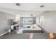 Bright living room featuring modern lighting, a comfortable white couch, and stunning waterfront views at 4725 Cove Cir # 604, St Petersburg, FL 33708