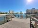 Scenic waterfront view showcasing buildings, a wooden pier, and clear blue water, a tranquil setting at 4725 Cove Cir # 604, St Petersburg, FL 33708