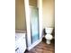 Modern bathroom with a glass-enclosed shower and white vanity at 4801 Haines N Rd, St Petersburg, FL 33714
