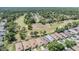 Residential homes overlooking a green golf course at 5429 Legend Hills Ln, Spring Hill, FL 34609
