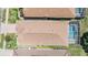 An overhead view featuring a backyard pool and brick roofing at 5429 Legend Hills Ln, Spring Hill, FL 34609