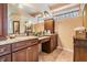 Dual vanity bathroom with granite countertops and tiled flooring at 5429 Legend Hills Ln, Spring Hill, FL 34609