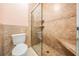 Well-lit bathroom features a walk-in shower with built-in seating and tiled walls at 5429 Legend Hills Ln, Spring Hill, FL 34609