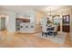 Cozy dining area adjacent to the kitchen featuring a stylish chandelier and built-in display cabinet at 5429 Legend Hills Ln, Spring Hill, FL 34609