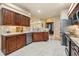 Spacious kitchen featuring stainless steel appliances, tile backsplash, and quartz countertops at 5429 Legend Hills Ln, Spring Hill, FL 34609