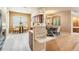Bright kitchen and dining area with white floors, modern appliances, and elegant dining set at 5429 Legend Hills Ln, Spring Hill, FL 34609