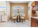 Eat-in kitchen with tile flooring, and wood cabinets at 5429 Legend Hills Ln, Spring Hill, FL 34609