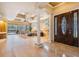 Spacious living room with high ceilings, hardwood floors, and seamless access to the outdoor pool area at 5429 Legend Hills Ln, Spring Hill, FL 34609
