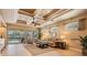 Bright living room showcasing neutral decor, hardwood flooring, and ample natural light at 5429 Legend Hills Ln, Spring Hill, FL 34609