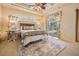 Bedroom featuring neutral walls, coffered ceilings, and access to a patio and pool at 5429 Legend Hills Ln, Spring Hill, FL 34609