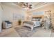 Bedroom featuring neutral walls, coffered ceilings, and hardwood floors at 5429 Legend Hills Ln, Spring Hill, FL 34609