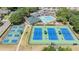 Aerial shot of community amenities including a pool, tennis courts, and clubhouse at 5429 Legend Hills Ln, Spring Hill, FL 34609