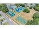 Aerial view of community amenities including tennis courts, pickleball courts and a basketball court at 5429 Legend Hills Ln, Spring Hill, FL 34609
