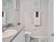 Well-lit bathroom featuring a granite countertop and a shower with white tiling at 5457 Leslie Canyon Dr, Wimauma, FL 33598