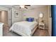 Comfortable bedroom features a full bed with decorative pillows, nightstand and neutral tones at 5457 Leslie Canyon Dr, Wimauma, FL 33598