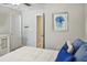 Comfortable bedroom featuring a queen bed with decorative pillows, and neutral tones at 5457 Leslie Canyon Dr, Wimauma, FL 33598